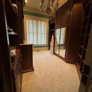 Massive closet with great storage, including dresser and separate hanging bars.