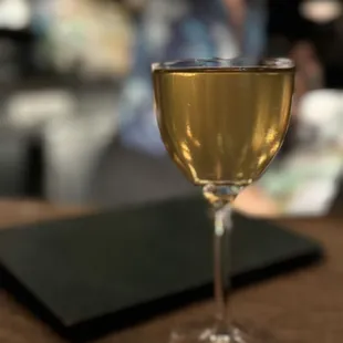 a glass of wine on a table