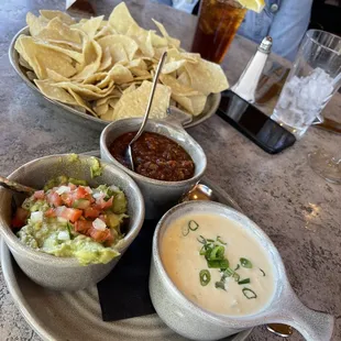 three bowls of soup and tortillas