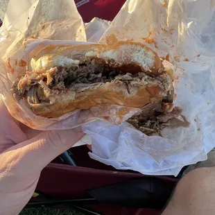 Half eaten bbq sandwich