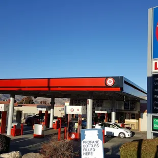a gas station with a large sign