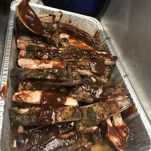 Ribs after getting their first round of saucy goodness