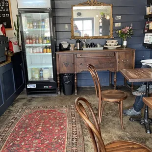 Cold beverages and cream and sugar station near more seating