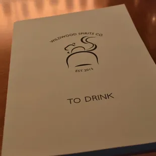 to drink menu on wooden table