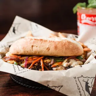 Korean Pork Philly - Pulled pork with peppers, onions, carrots,
mushrooms, water chestnuts, melted white cheddar, and Korean BBQ.