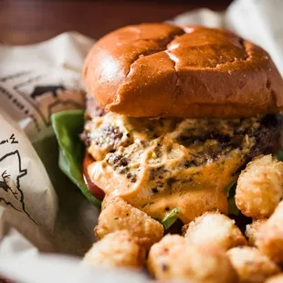 French Quarter - CAB Burger Seasoned with Cajun Rub, grilled &amp; topped with bibb lettuce, tomato, remoulade dressing.