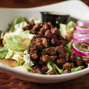 Wildblue Steak Salad - Seasoned skirt steak, mixed greens with crumbled bleu cheese, red onions, toasted almonds and Honey Mustard Dressing.