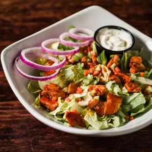 Buffalo Chicken Salad - Fresh Greens with chopped celery, carrots, red onion, and grilled
buffalo chicken.