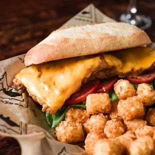 Just A Fish Sandwich - made with wild haddock. Served on a toasted hoagie bun with bibb lettuce, tomato, tartar sauce, and american cheese.