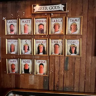 a wall of beer god portraits