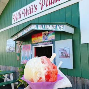 a hand holding a cone of ice cream