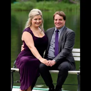 a man and a woman sitting on a bench