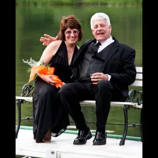 a man and woman sitting on a bench