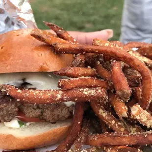 a burger with onion rings