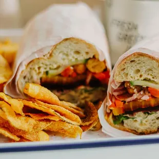 Rainbow sandwich, roasted beets, frisée, peppers,  marinated cucumbers,  red onions, hummus