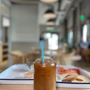 a glass of iced coffee on a table
