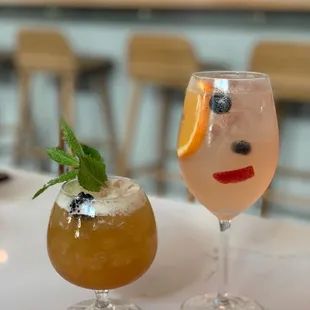 a glass of wine and a glass of lemonade