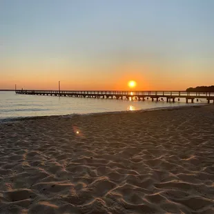  a pier at sunset