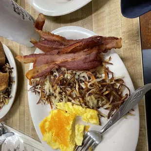 bacon, eggs, hash browns and toast