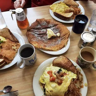 Hart's Content Omelette (bottom), Willalby's Omelette (left), Ham &amp; Cheese Omelette (top), and a pancake (center)