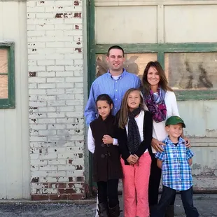 When it ALL began, Willcott Family standing in front of the future 1st location of Willcott Brewing Company, Holton KS.