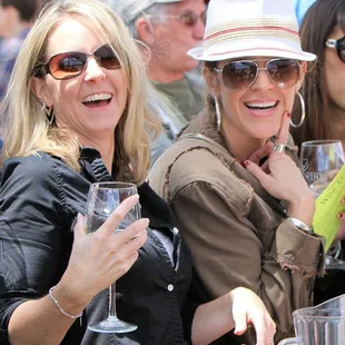 a group of women drinking wine