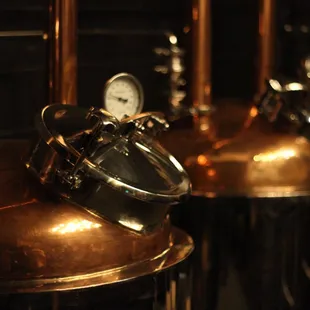 a row of copper pots