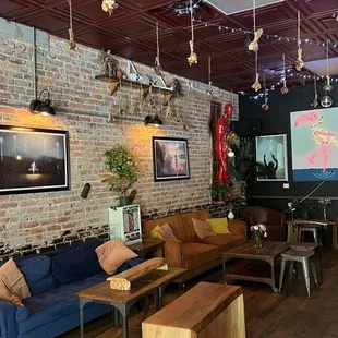 a living room with blue couches