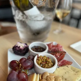 cheese, crackers, grapes, and nuts