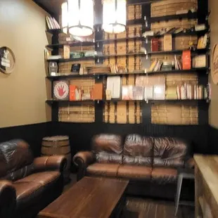 a living room with leather furniture