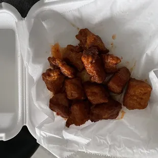 chicken nuggies in a styrofoam container