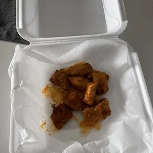 chicken wings in a styrofoam container