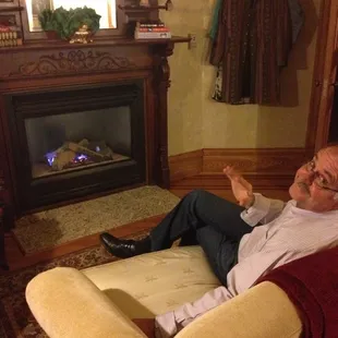 Relaxing in front of the fireplace in our room.