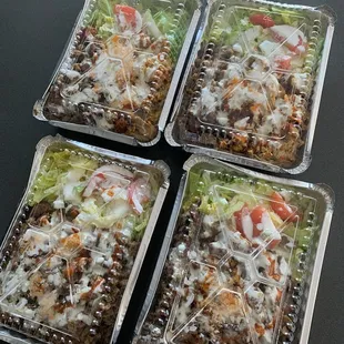 four trays of halal salad