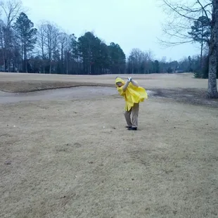 Golfing in the rain at Williamsburg National Golf Club.