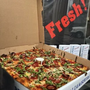 a fresh pizza in a box