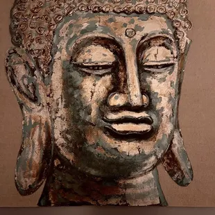 a painting of a buddha head