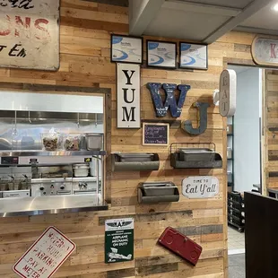 a wooden wall with various signs