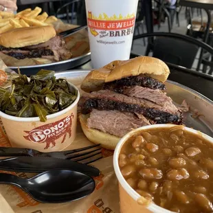 Brisket sandwich with baked beans and turnip greens