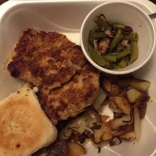 2 Fried pork chops, green beans, pan fried potatoes.