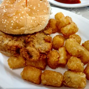 Chicken fried steak sandwich with tots