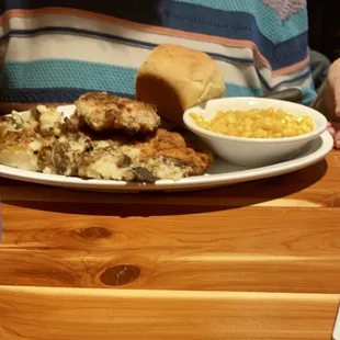 Fried pork chops w/ fried potatoes , roll &amp; corn