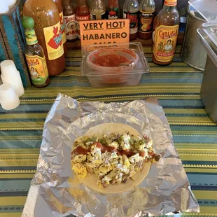 Loaded breakfast taco and hot sauce/salsa bar