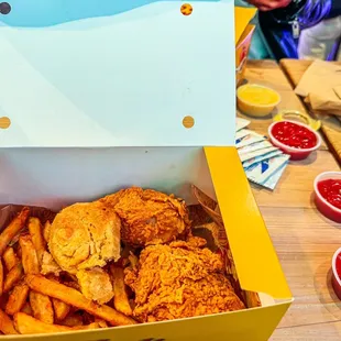 a box of fried chicken and french fries