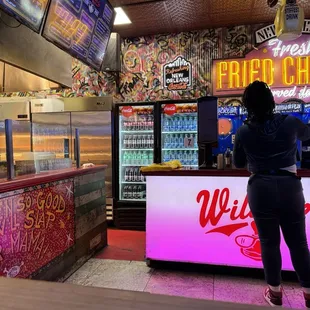 a woman standing in front of the counter