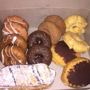 Mixture of donuts.  Cherry Cake, Pumpkin Spice, Sour Cream, Boston Creme, Chocolate Glazed, The Earl, and cinnamon sugar.
