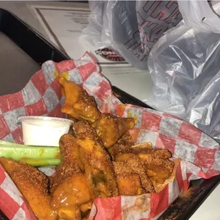 a basket of fried wings