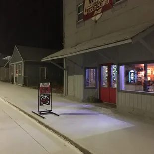 a snowy street at night