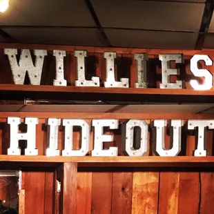 a sign for willie&apos;s hideout
