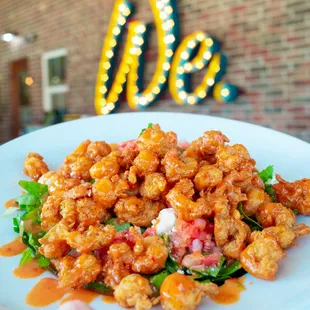 Kung Pao Crawfish Salad: fried crawfish tails tossed in Pao sauce with feta cheese and pico